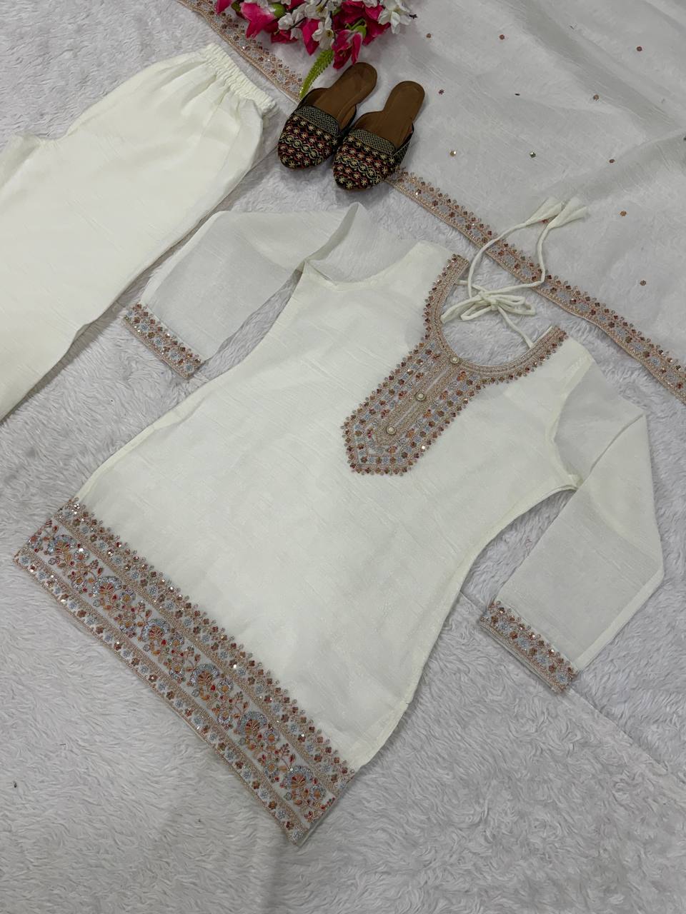 Pristine Ivory White Kurta and Palazzo Set Featuring Delicate Floral Embroidery, Sequined Borders, and a Matching Sheer Dupatta